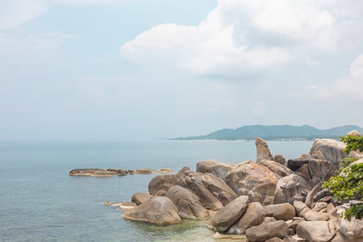 Sea landscape with rocks in the foreground and sky in the background. Therapeutic natural scenery gives a feeling of relaxation. At Koh Samui, Surat Thani Province, Thailand photo