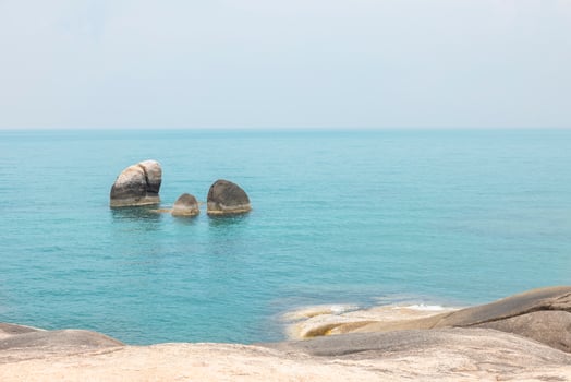 Sea landscape with rocks in the foreground and sky in the background. Therapeutic natural scenery gives a feeling of relaxation. At Koh Samui, Surat Thani Province, Thailand photo