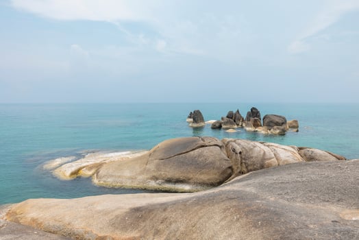 Sea landscape with rocks in the foreground and sky in the background. Therapeutic natural scenery gives a feeling of relaxation. At Koh Samui, Surat Thani Province, Thailand photo