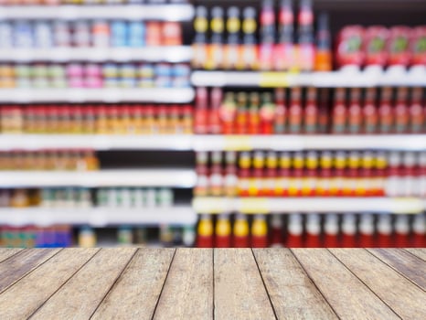 Supermarket shelves with abstract defocused blur background photo