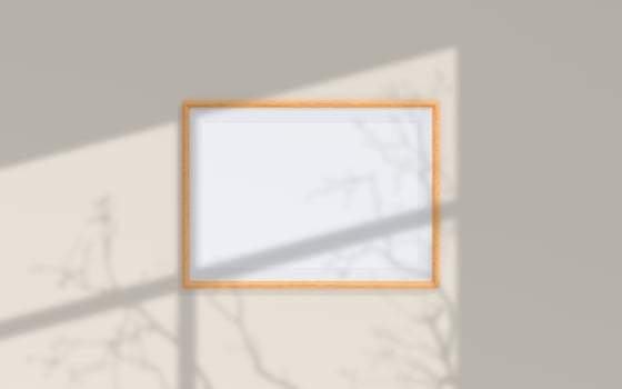 Clean and minimalist front view landscape wooden photo or poster frame mockup hanging on the wall with shadow overlay. 3d rendering.