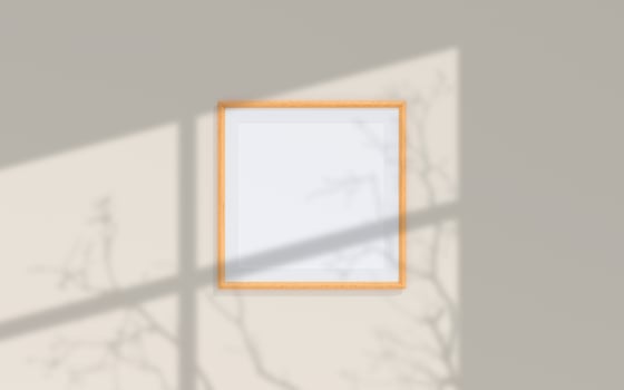 Clean and minimalist front view square wooden photo or poster frame mockup hanging on the wall with shadow overlay. 3d rendering.