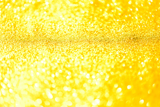 Golden glitter bokeh lighting texture Blurred abstract background for birthday, anniversary, wedding, new year eve or Christmas photo