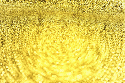 Golden glitter bokeh lighting texture Blurred abstract background for birthday, anniversary, wedding, new year eve or Christmas photo