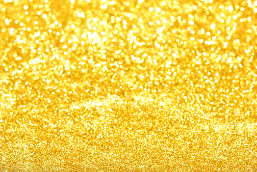 Golden glitter bokeh lighting texture Blurred abstract background for birthday, anniversary, wedding, new year eve or Christmas photo