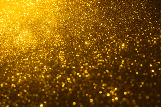 Golden glitter bokeh lighting texture Blurred abstract background for birthday, anniversary, wedding, new year eve or Christmas photo