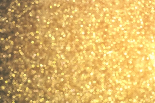 Golden glitter bokeh lighting texture Blurred abstract background for birthday, anniversary, wedding, new year eve or Christmas photo