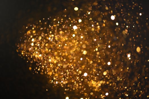Golden glitter bokeh lighting texture Blurred abstract background for birthday, anniversary, wedding, new year eve or Christmas photo