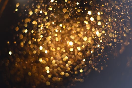 Golden glitter bokeh lighting texture Blurred abstract background for birthday, anniversary, wedding, new year eve or Christmas photo