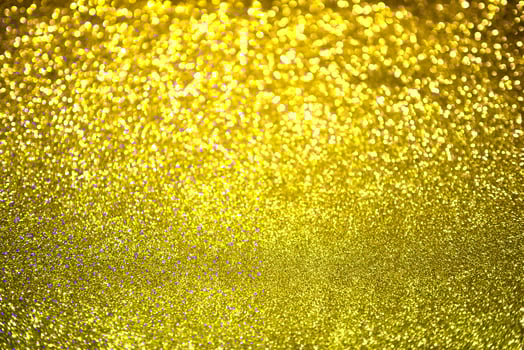 Golden glitter bokeh lighting texture Blurred abstract background for birthday, anniversary, wedding, new year eve or Christmas photo