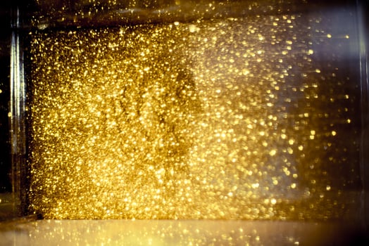 Golden glitter bokeh lighting texture Blurred abstract background for birthday, anniversary, wedding, new year eve or Christmas photo