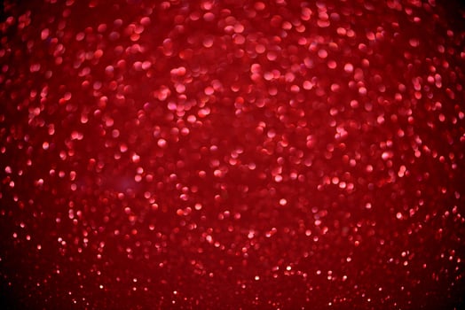 red glitter bokeh lights Blurred abstract background for Valentines, birthday, anniversary, wedding, new year and Christmas photo