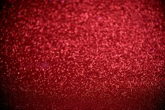 red glitter bokeh lights Blurred abstract background for Valentines, birthday, anniversary, wedding, new year and Christmas photo