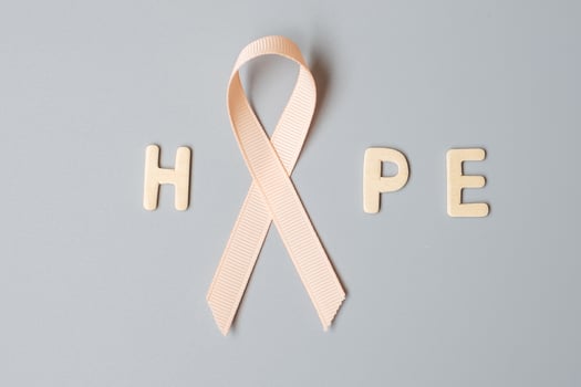 September Uterine Cancer Awareness month, Peach Ribbon for supporting people living and illness. Healthcare and World cancer day concept photo