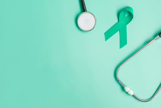 September Ovarian cancer Awareness month, teal Ribbon with stethoscope for supporting people living, and illness. Healthcare and world cancer day concepts photo