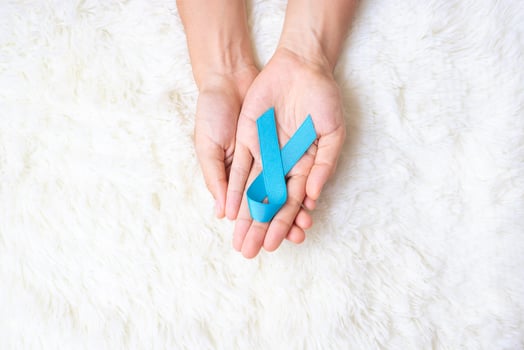 November Prostate Cancer Awareness month, Man holding light Blue Ribbon for supporting people living and illness. Healthcare, International men, Father, World cancer day and world diabetes day concept photo
