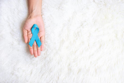November Prostate Cancer Awareness month, Man holding light Blue Ribbon for supporting people living and illness. Healthcare, International men, Father, World cancer day and world diabetes day concept photo