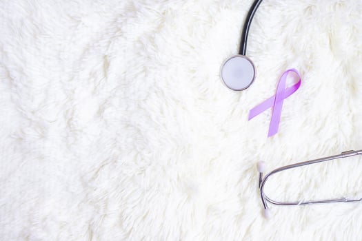 World cancer day . Lavender purple ribbon with stethoscope for supporting people living and illness. Healthcare and medical concept photo