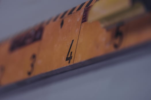 An old school ruler made of wood photo