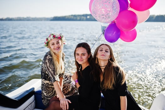 Girls having fun at yacht on hen party. photo