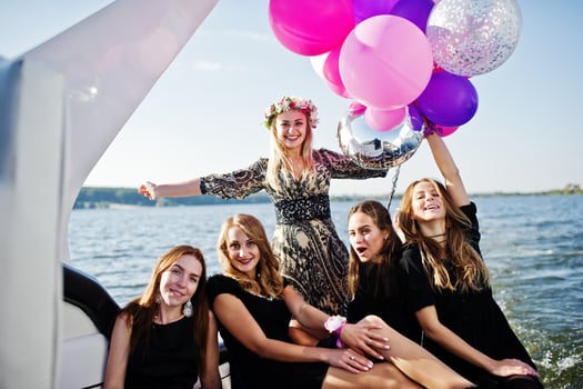 Girls having fun at yacht on hen party. photo
