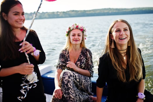 Girls having fun at yacht on hen party. photo