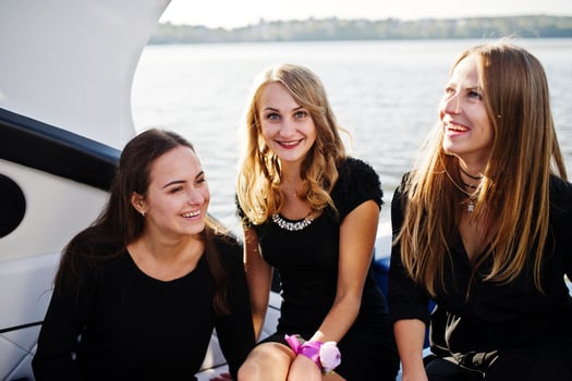 Girls having fun at yacht on hen party. photo