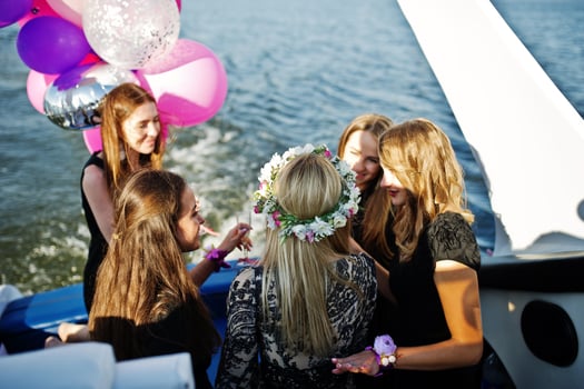 Girls having fun at yacht on hen party. photo
