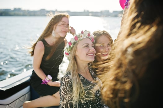 Girls having fun at yacht on hen party. photo