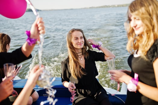 Girls having fun at yacht on hen party. photo