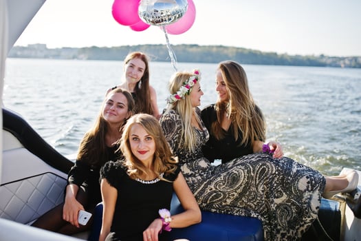 Girls having fun at yacht on hen party. photo