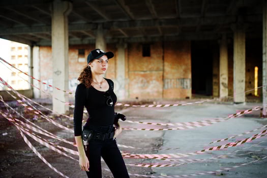 Sexy FBI female agent at abadoned place. photo