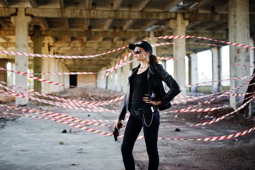 Sexy FBI female agent at abadoned place. photo