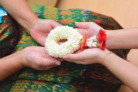 Give Thai traditional jasmine garland to mother, Thai traditional jasmine garland. symbol of Mother's day in thailand photo