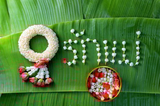 Thai traditional jasmine garland. symbol of Mother's day in thailand on Banana leaf with Love Mother in Thai word. photo