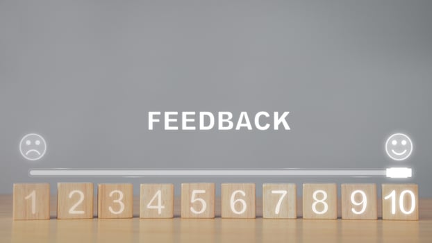 Evaluation and satisfaction concept. Feedback level from 1 to 10. Close up shot on wood blocks with copy space. photo