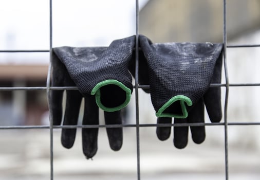 Gloves hanging on a fence photo
