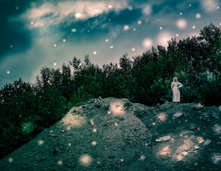 Fantasy landscape with a girl in white on a rock photo