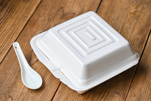 lunch box foam , food box takeaway food , street food - dangerous to health waste garbage foam food concept photo