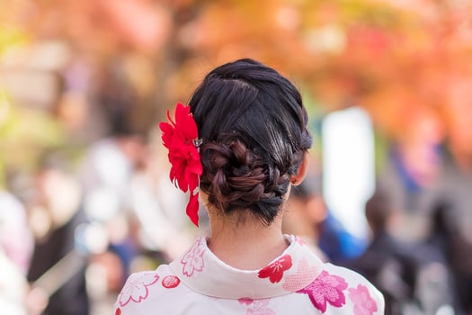 young woman tourist wearing kimono enjoying with colorful leaves in Kiyomizu dera temple, Kyoto, Japan. Asian girl with hair style in traditional Japanese clothes in Autumn foliage season photo