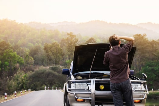 Man try to fix a car engine problem on a local road Chiang mai Thailand - people with car problem transportation concept photo