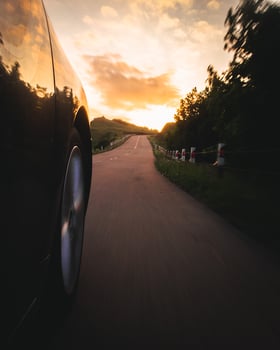 Close up of wheel in motion blur on asphalt road. Adventure and off road tours in Caucasus. Travel in Georgia photo