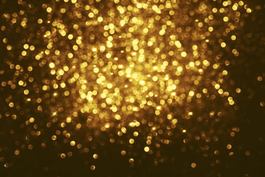 Golden glitter bokeh lighting texture Blurred abstract background for birthday, anniversary, wedding, new year eve or Christmas photo