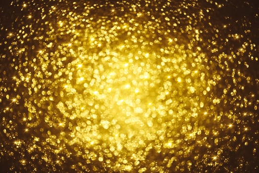 Golden glitter bokeh lighting texture Blurred abstract background for birthday, anniversary, wedding, new year eve or Christmas photo