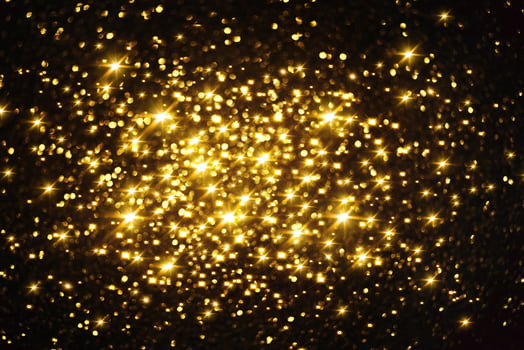 Golden glitter bokeh lighting texture Blurred abstract background for birthday, anniversary, wedding, new year eve or Christmas photo