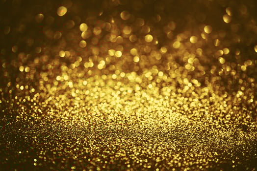 Golden glitter bokeh lighting texture Blurred abstract background for birthday, anniversary, wedding, new year eve or Christmas photo
