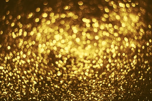 Golden glitter bokeh lighting texture Blurred abstract background for birthday, anniversary, wedding, new year eve or Christmas photo