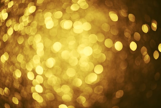 Golden glitter bokeh lighting texture Blurred abstract background for birthday, anniversary, wedding, new year eve or Christmas photo