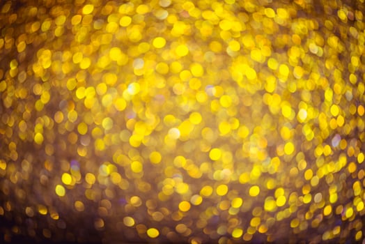 Golden glitter bokeh lighting texture Blurred abstract background for birthday, anniversary, wedding, new year eve or Christmas photo