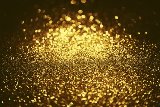 Golden glitter bokeh lighting texture Blurred abstract background for birthday, anniversary, wedding, new year eve or Christmas photo